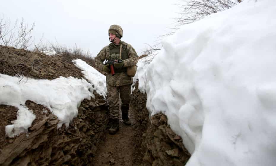 A Ukrainian soldier walks on a trench on the frontline in Donetsk.