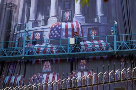 Images of Donald Trump and his family on top of US flag-draped coffins, at Palestine Square in Tehran.