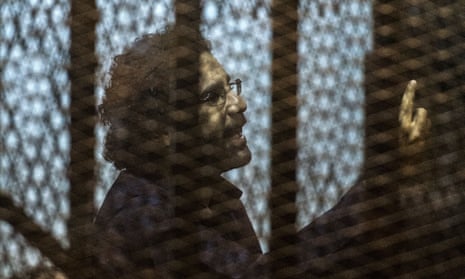 Alaa Abd El-Fattah in the defendant’s cage during his 2015 trial for insulting the judiciary.