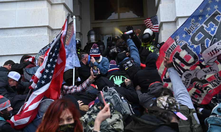 Trump supporters clash with police and security as they force their way into the US Capitol building.