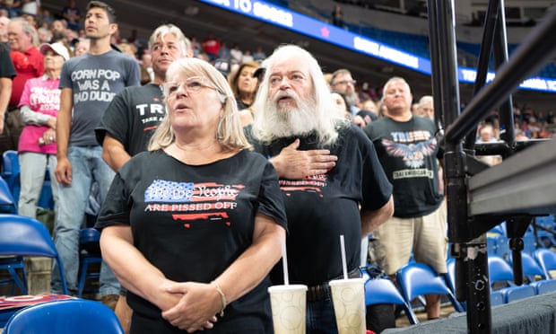 People participate in a prayer before the Trump rally.