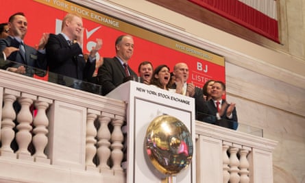 Cunningham and executives from BJ’s ring the exchange’s bell to announce the wholesale retailer’s share sale