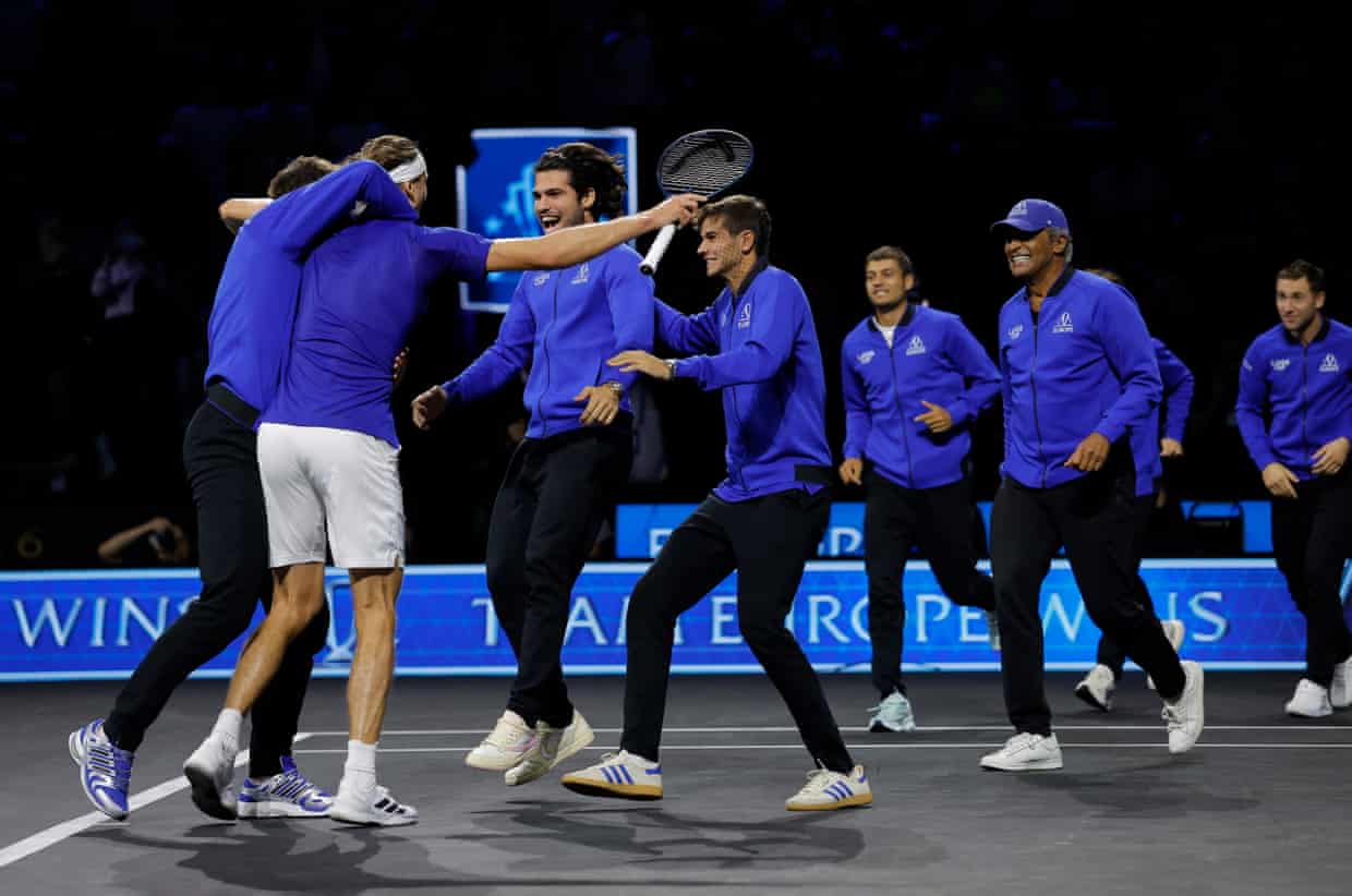 The players of Team Europe run onto court to celebrate winning the Laver Cup.