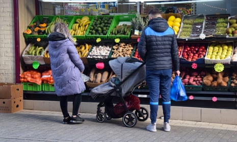 A man and woman shop for fruit and vegetables in Maidstone.