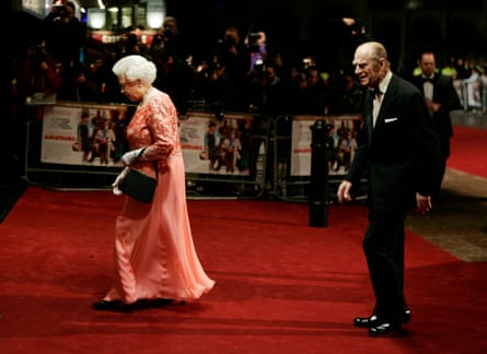 Queen Elizabeth II accompanied, a few steps behind by Prince Philip, at the Royal Film Performance of A Bunch of Amateurs in London in 2008