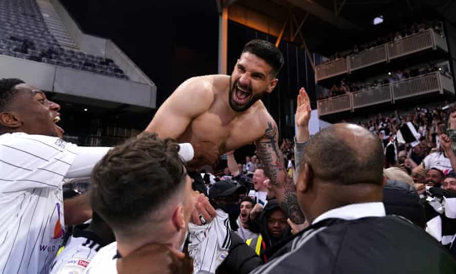 Aleksandar Mitrovic celebrates after scoring the final goal in Fulham's 7-0 win over Luton at Craven Cottage that sealed the title.