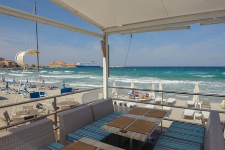 Beach at L’iIle Rousse viewed from the Restaurant le Marinella. Corsica. France. Europe