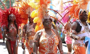 Masquerade dancers take part in the parade