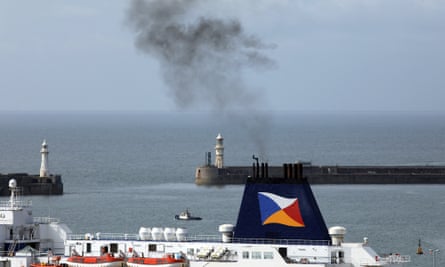 Smoke rises from a ferry at Dover, UK.
