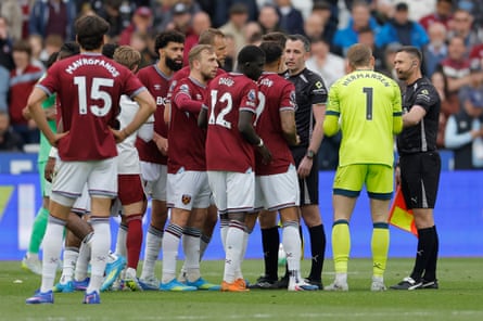 West Ham players confront the referee after the final whistle following the VAR ruling that disallowed their late equaliser against Arsenal.