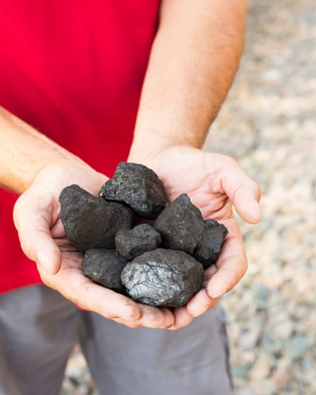 Gerren Anderson holds coal extracted from the land in the North Fork Valley.