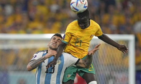 Young Socceroo Garang Kuol challenges Argentina's Cristian Romero during their World Cup round of 16  match in Qatar.