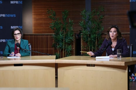 Peggy Flanagan and Michele Tafoya debate at separate podiums with microphones