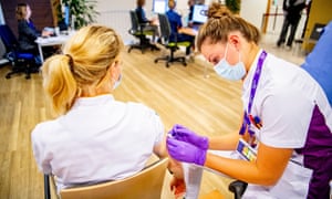 Covid live: WHO director says Europe is again centre of pandemic with France and Netherlands set for new measures 5 A healthcare workers receives a Pfizer booster vaccine in Dordrecht, the Netherlands.