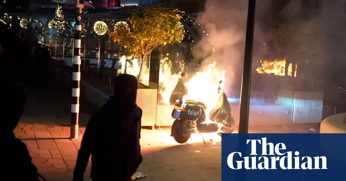 Rotterdam riot: police fire shots as Covid protesters torch vehicles ...