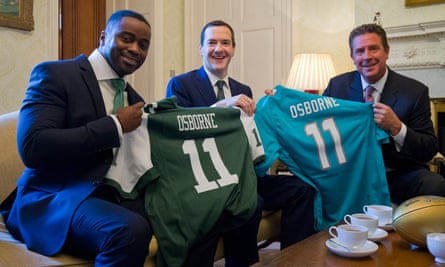 George Osborne with former NFL players Dan Marino, right, and Curtis Martin.