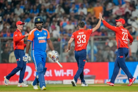 England's players celebrates the wicket of India's Sanju Samson.