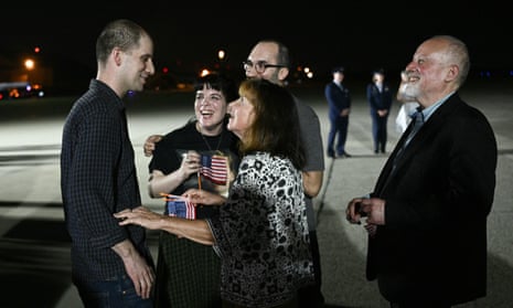 Former prisoner held by Russia US journalist Evan Gershkovich is greeted by his parents Mikhail Gershkovich and Ella Milman with his sister Danielle Gershkovich and brother-in-law Anthony Huczek as he arrives at Joint Base Andrews in Maryland on August 1, 2024.