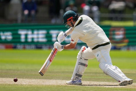 Travis Head plays a low shot during a cricket test match