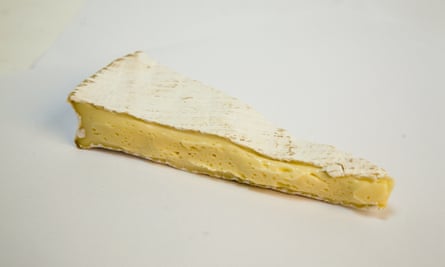 A triangular slice of Brie de Meaux