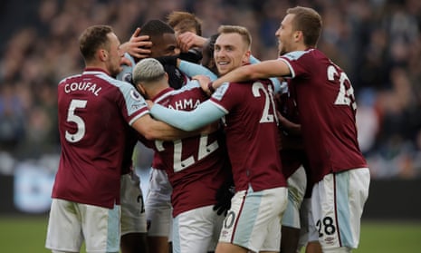 The rest of the West Ham players mob Athur Masuaku after he scored their winning goal.