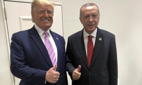 Turkey’s President Recep Tayyip Erdogan, right, and U.S President Donald Trump gesture during the G-20 summit in Osaka, Japan, Friday, June 28, 2019. (Presidential Press Service via AP, Pool)