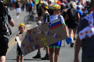 woman and child with poster with Slovak flag