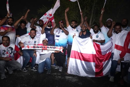 Fans welcome the England team to their hotel in Doha.