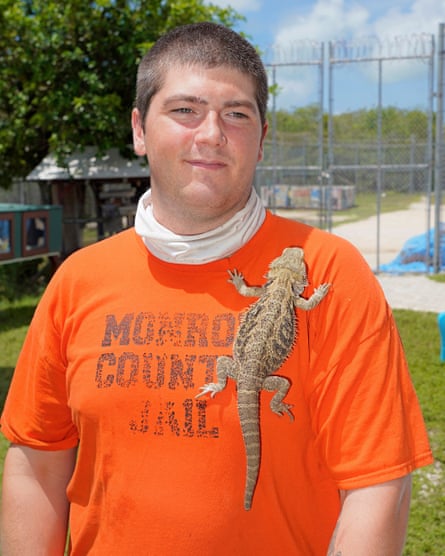Peter Faraco, a then-inmate in the Monroe County detention center, with a lizard in the jail’s on-site zoo in July 2021