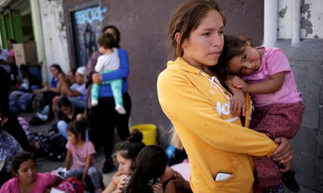 Migrant families wait to apply for asylum at the US border in Juárez, Mexico, on Wednesday.
