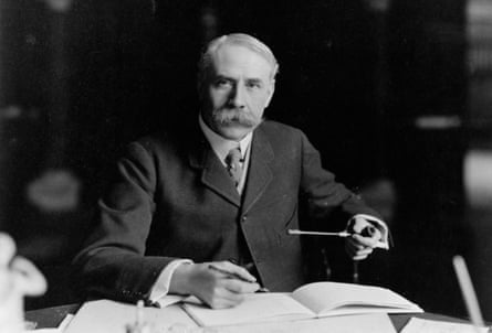 British composer Edward Elgar (1857 - 1934) seated at his desk at Severn House in Hampstead.