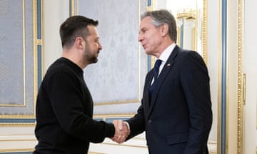 Volodymyr Zelenskiy shakes hands with Antony Blinken