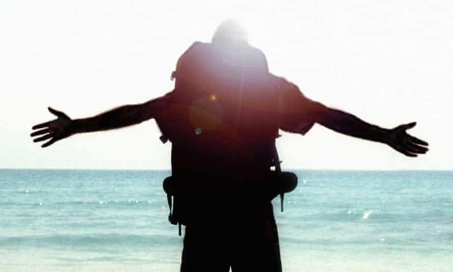 Backpacker looking out at sea