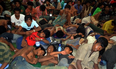 Boat people from Burma and Bangladesh collapsed in exhaustion at the Langkawi police station’s multi purpose hall in Langkawi on Monday.