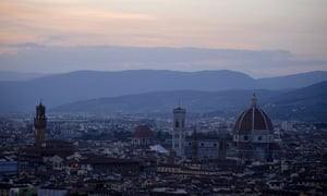 Florence with the Duomo (R) of the cathedral Santa Maria del Fiore and the tower of the Palazzo Vecchio (L), Florence’s city hall.