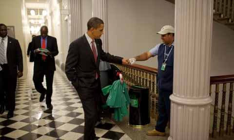 President Barack Obama fist-bumps custodian Lawrence Lipscomb in the Eisenhower Executive Office Building.