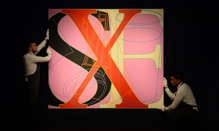 Art handlers with Untitled (SEX) by Michael Craig-Martin during The George Michael Collection art sale at Christie’s, London.