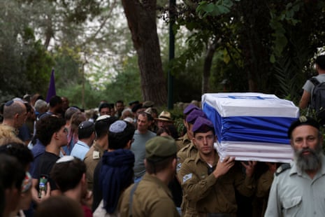 Pallbearers carry the casket of Lavi Lipshitz, 20, who was killed in the northern Gaza Strip during the ground operation of the Israeli army