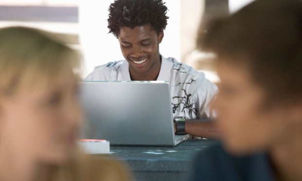 A university student working on a laptop