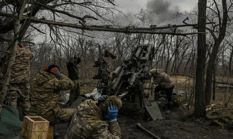 Ukrainian servicemen fire towards Russian positions on the front line near Bakhmut.