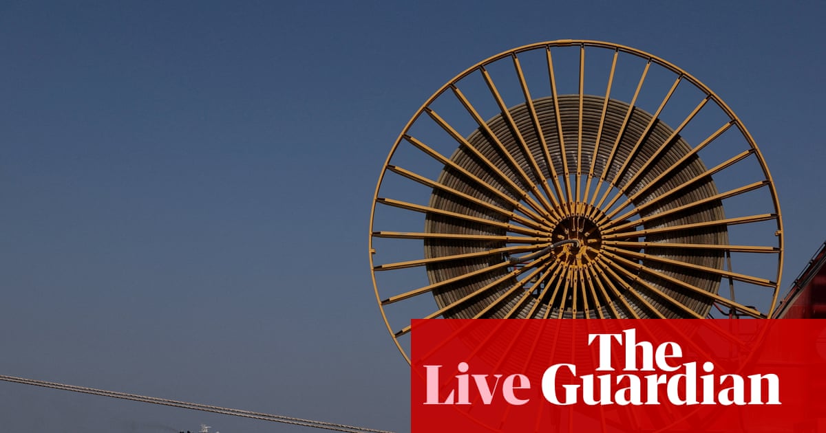 Iran deal hopes push oil price to two-week low below $100; UK builders hit by surge in costs – business live