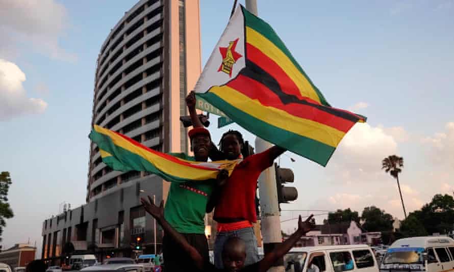 Zimbabweans cheering Mugabe’s resignation in November.
