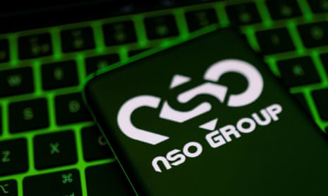NSO Group logo is shown on a smartphone 