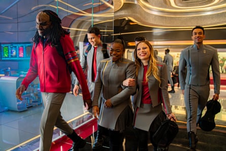 Starfleet Academy walking down a corridor.