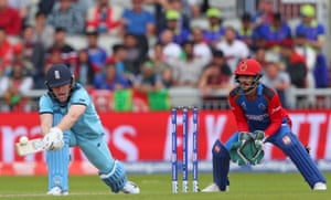 Eoin Morgan of England plays a reverse sweep and picks up 18 off the over.