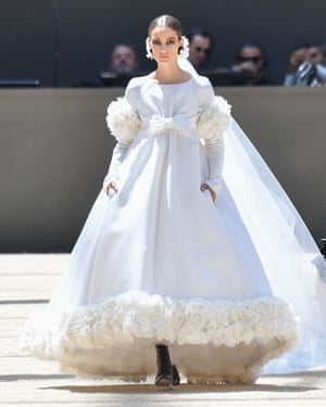 A voluminous feather-trimmed bridal gown.