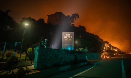 Flames from the Palisades fire reach the grounds of the Getty Villa museum in LA on 8 January.