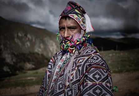 Portrait of a Quechua man in traditional dress during the Compadres festival.