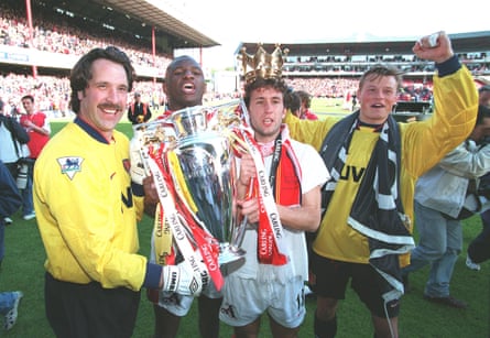 Manninger (right) pictured with (from left) David Seaman, Patrick Vieira and Gilles Grimandi as they parade the FA Premiership trophy in 1998