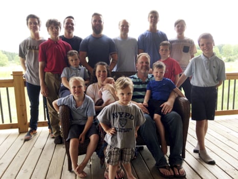 The Schwandt family at their farm in Lakeview, Michigan, in 2018. Standing from left are Tommy, Calvin, Drew, Tyler, Zach, Brandon, Gabe, Vinny and Wesley. Seated, starting at upper left are Charlie, Luke, mother Kateri holding Finley, father Jay with Tucker and Francisco in the foreground.